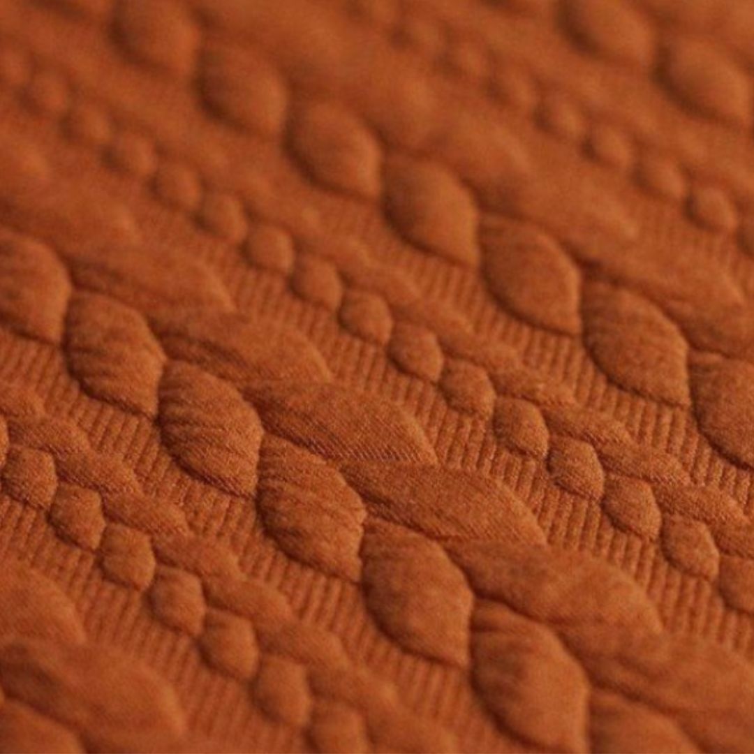 Jacquard Strickstoff Zopfmuster Cognac